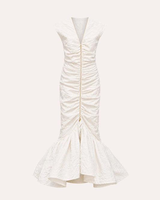 An off-white textured sleeveless dress with a deep V-neckline, front ruching, and a flared mermaid-style hem, shown against a plain white background.
