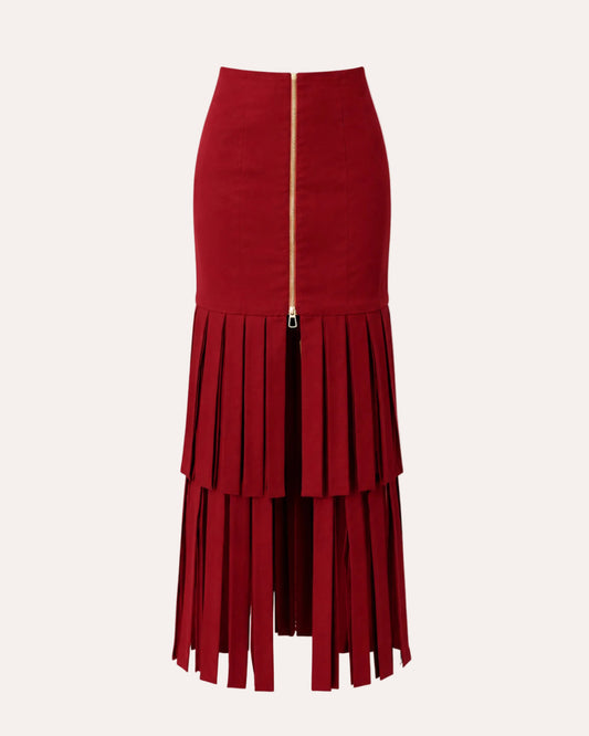 A red midi skirt featuring a high-waisted fitted top section, a tiered pleated lower half, and a prominent gold front zipper.
